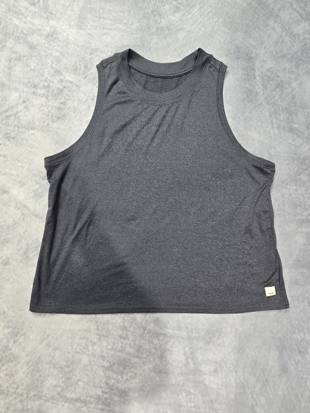 Vuori women's athletic tank top features a sleeveless design and a charcoal heat